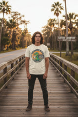Beige t-shirt with a graphic of a gator and text 'Welcome to Gator Country' on a white background