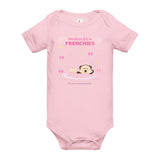 Pink baby onesie with 'Snuggles & Frenchie' text and graphics on a white background