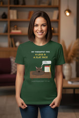 Woman wearing a green t-shirt with a humorous graphic and text in a living room setting.